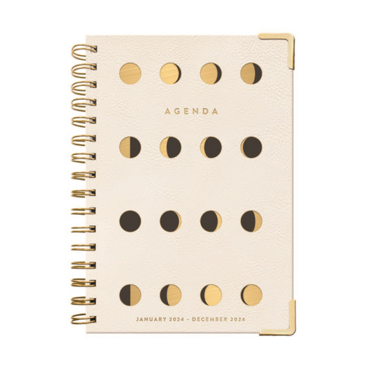cream agenda with multiple moon phases designed on the front.