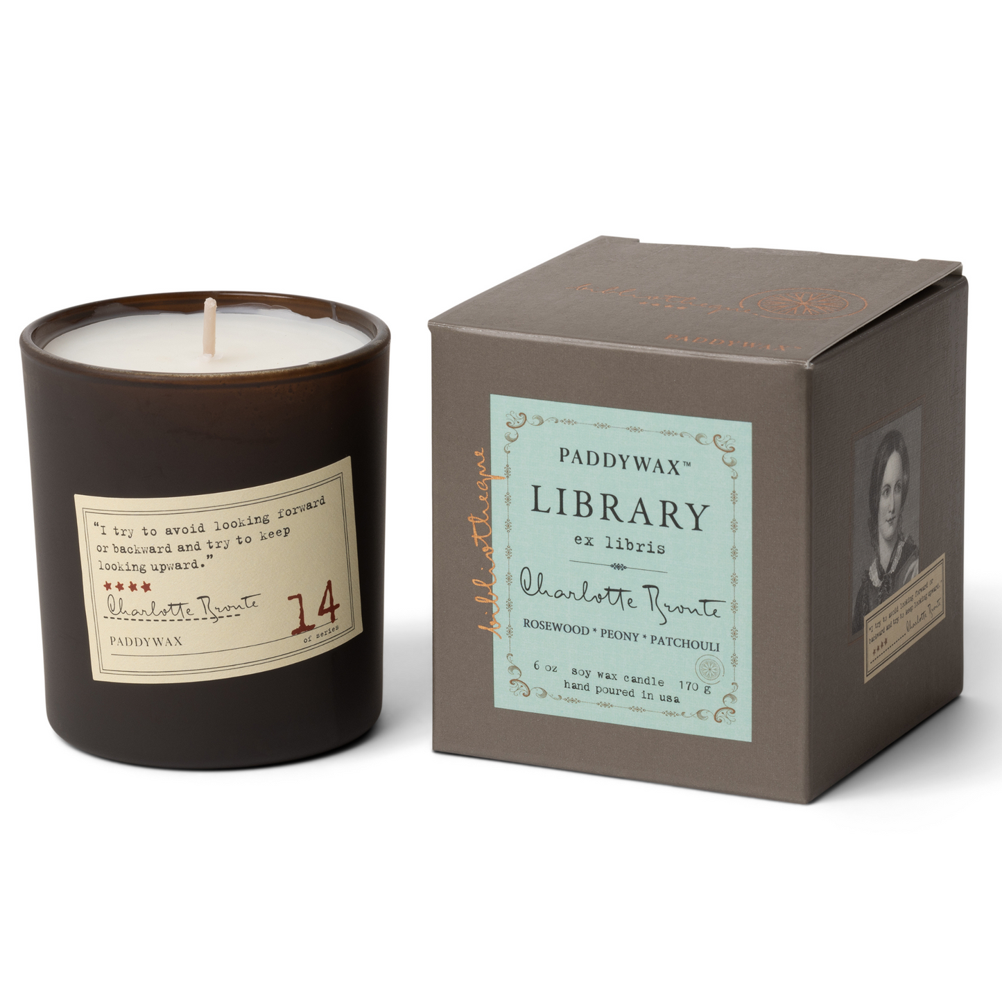 Black candle with cream sticker next to grey box with blue label.
