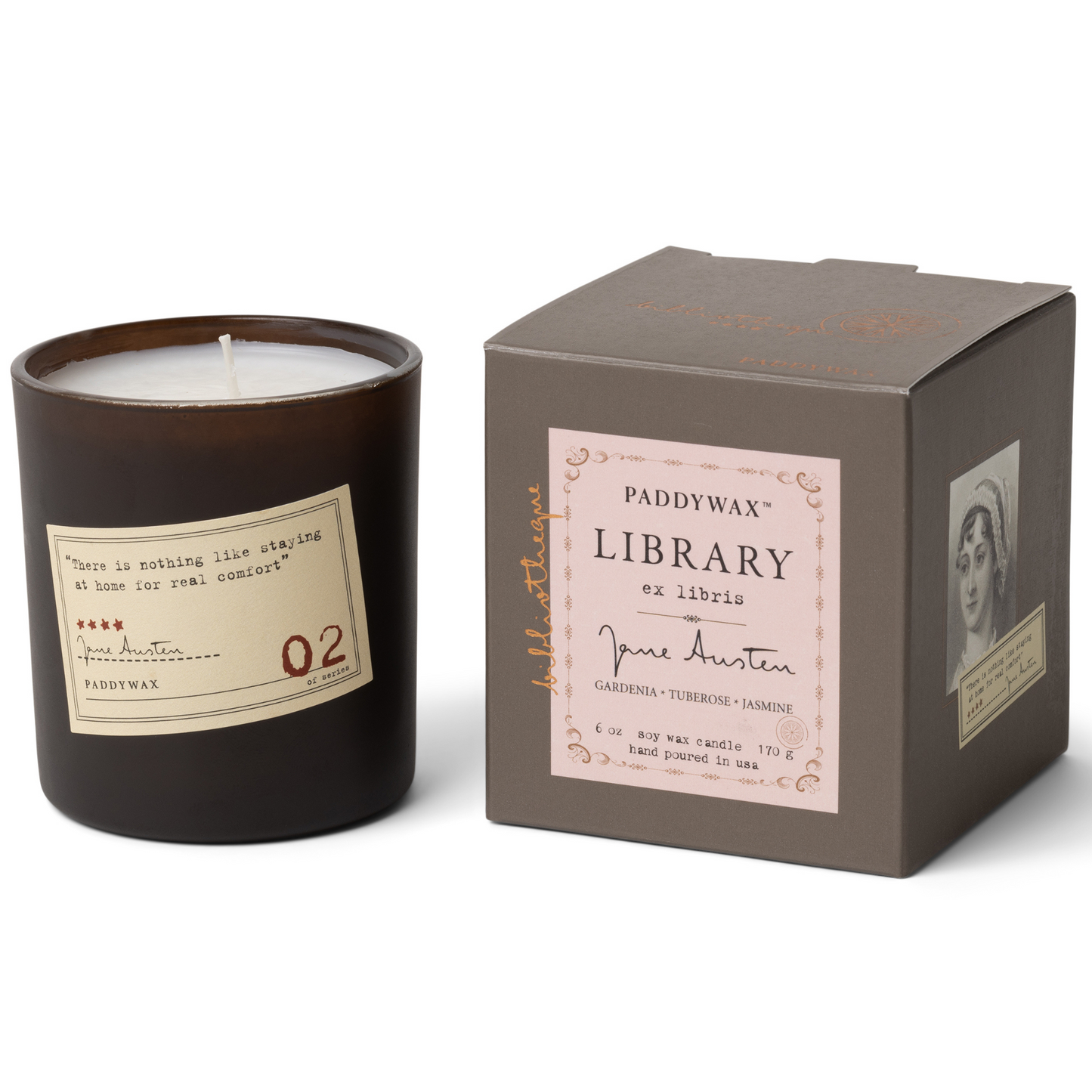 Black Candle with sticker next to gray box.