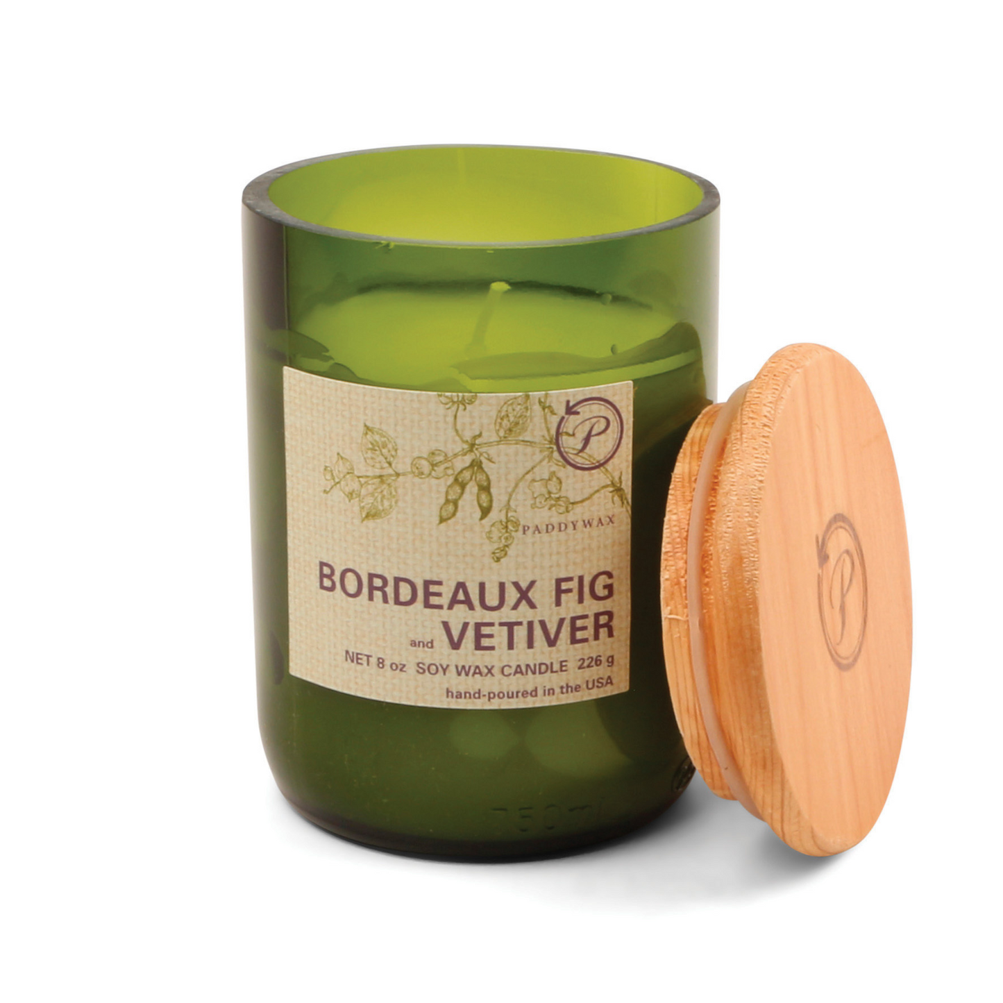 Green glass candle with a wooden lid and printed sticker on the front.
