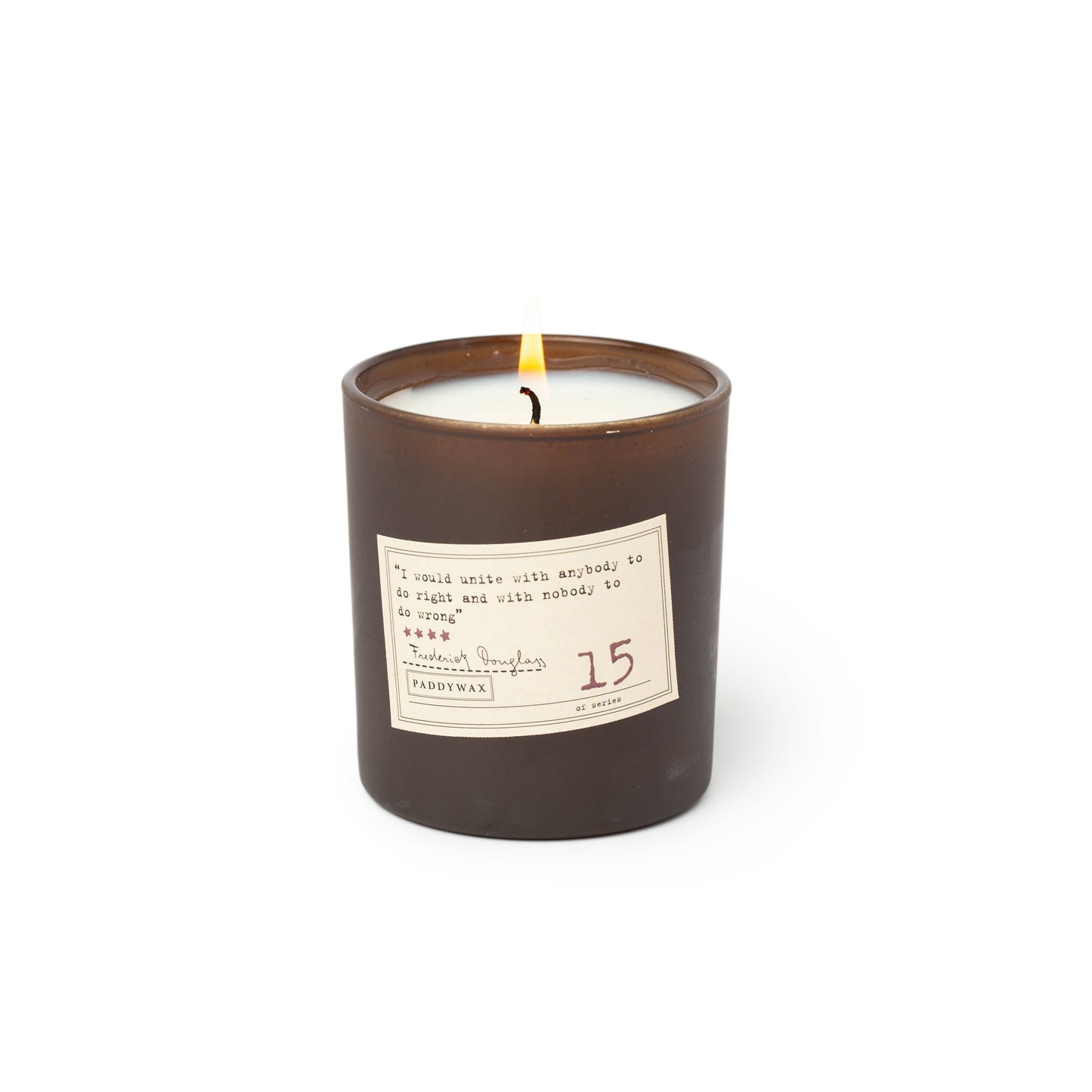 black candle with cream label on the front